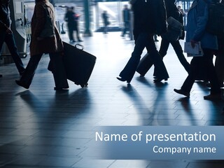 A Group Of People Walking Through A Train Station PowerPoint Template