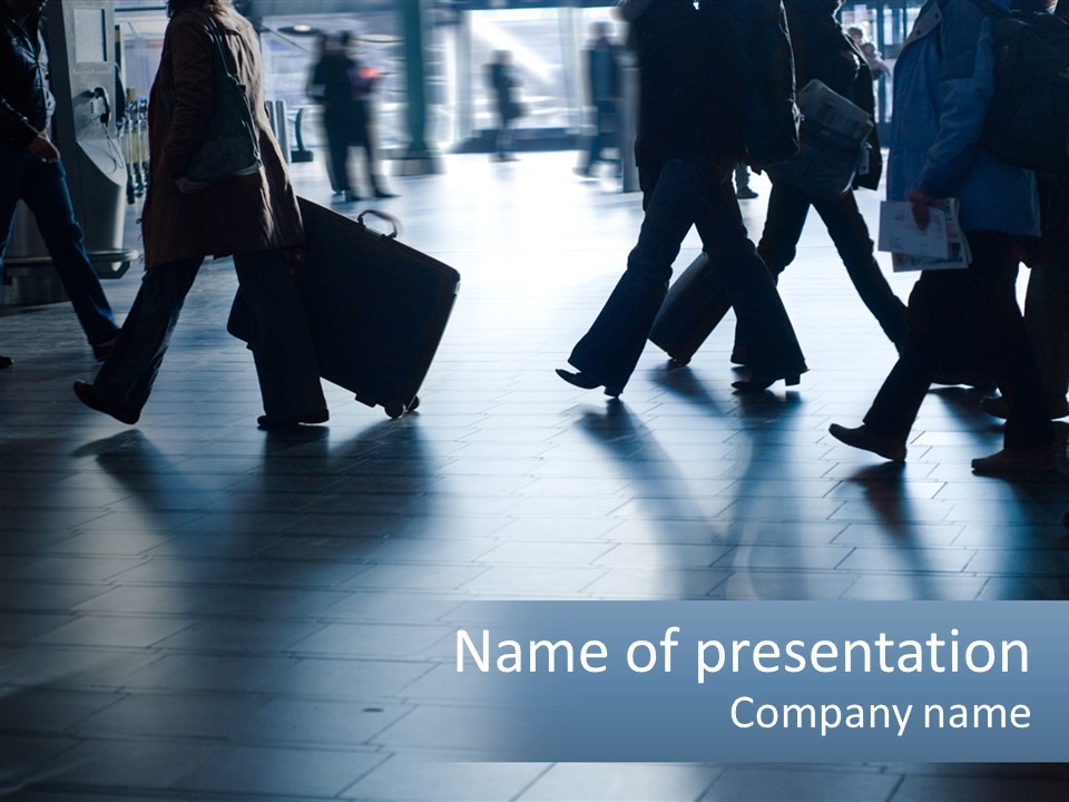 A Group Of People Walking Through A Train Station PowerPoint Template