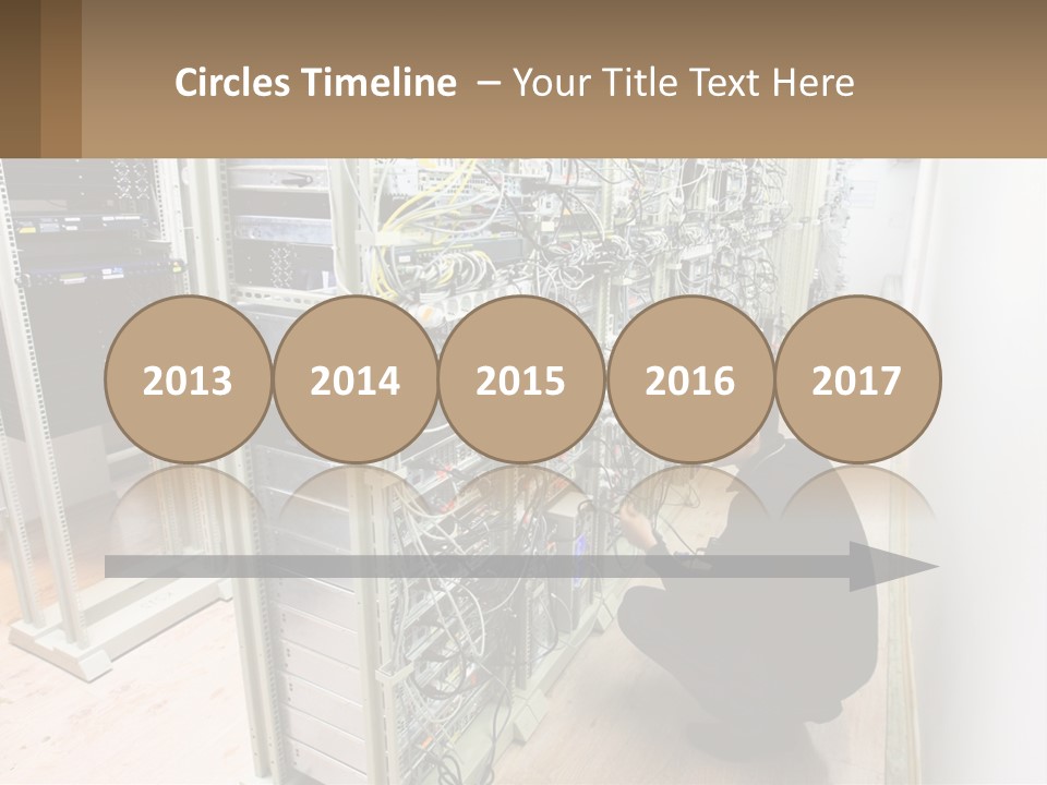 A Man Sitting On The Floor In Front Of A Server PowerPoint Template