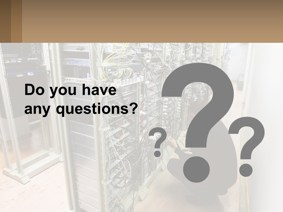 A Man Sitting On The Floor In Front Of A Server PowerPoint Template