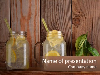 Two Mason Jars With Lemons And Mints On A Wooden Table PowerPoint Template