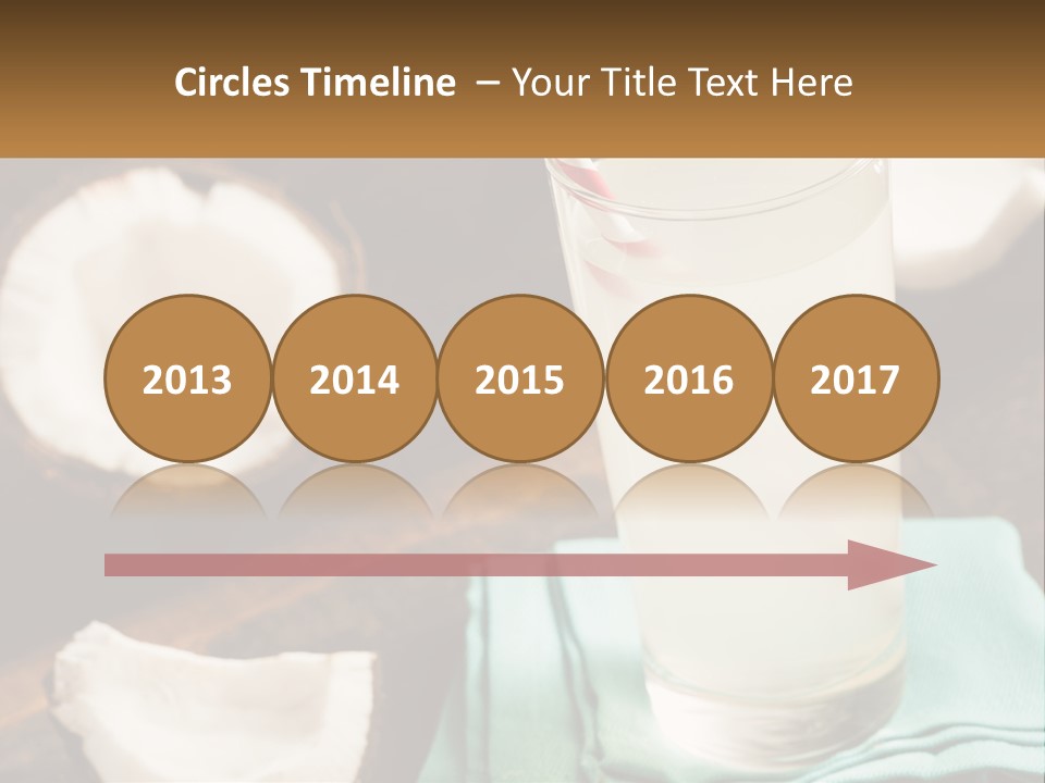 A Glass Of Water Next To Some Coconuts On A Table PowerPoint Template