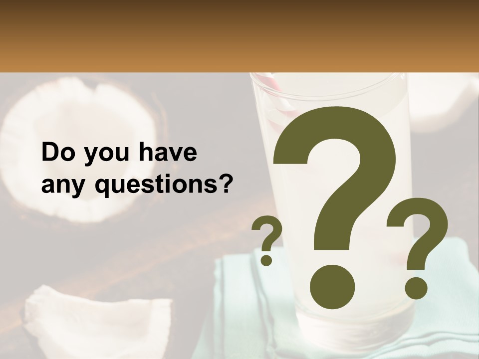 A Glass Of Water Next To Some Coconuts On A Table PowerPoint Template