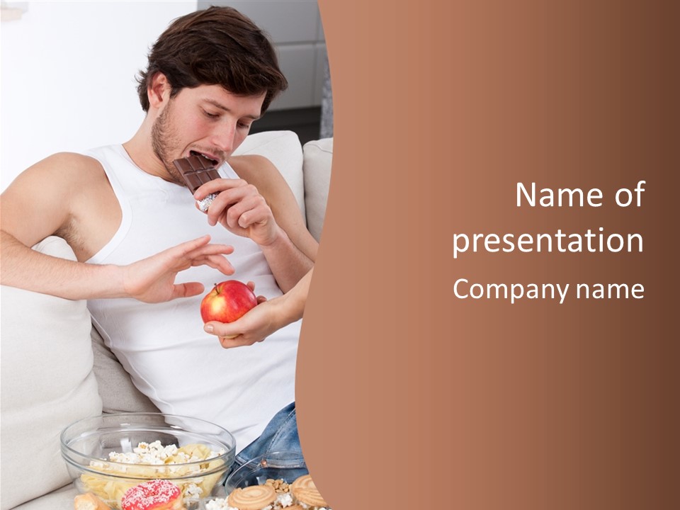 A Man Sitting On A Couch Eating An Apple PowerPoint Template