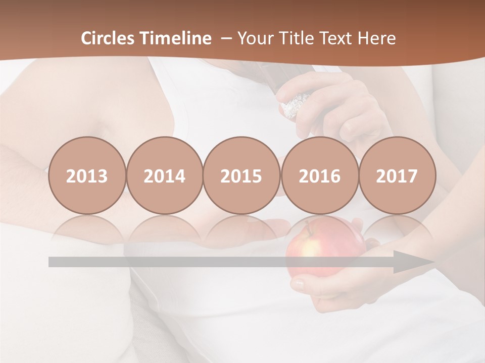 A Man Sitting On A Couch Eating An Apple PowerPoint Template