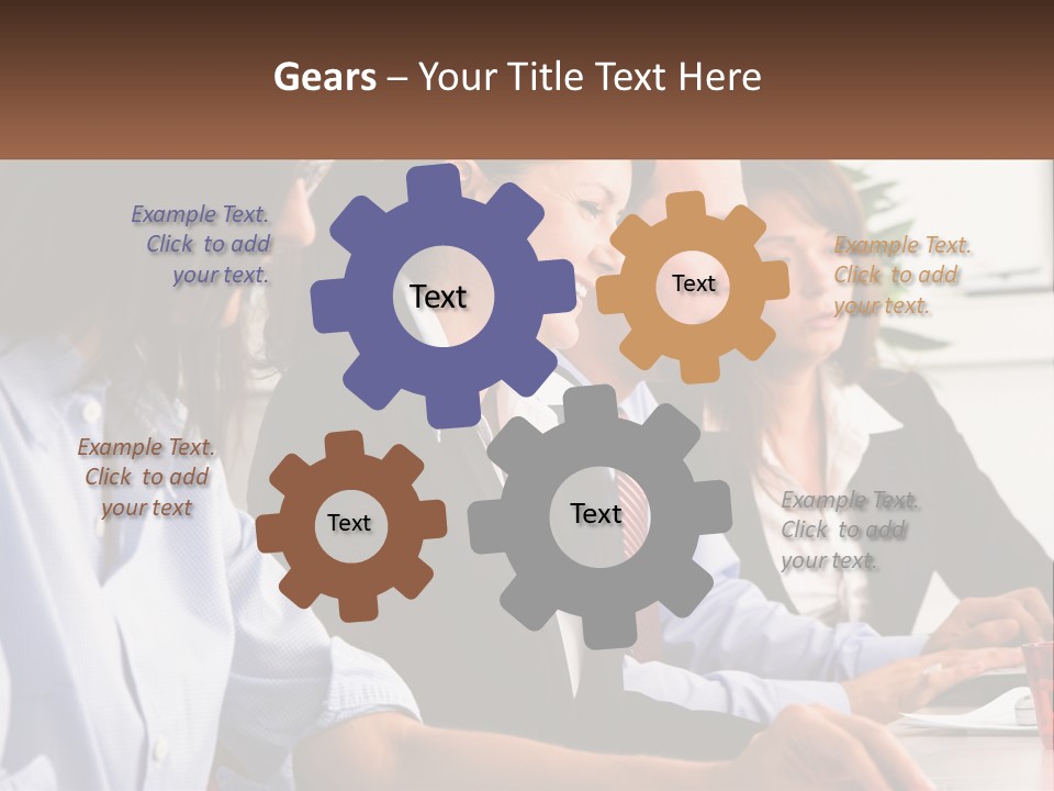 A Group Of People Sitting At A Table Working On A Computer PowerPoint Template
