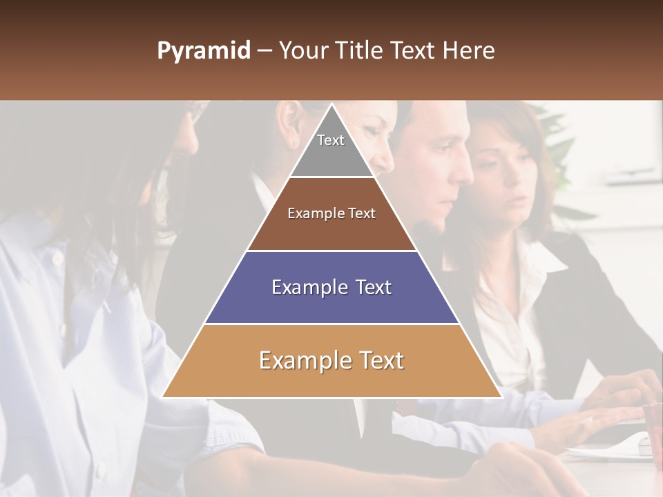 A Group Of People Sitting At A Table Working On A Computer PowerPoint Template