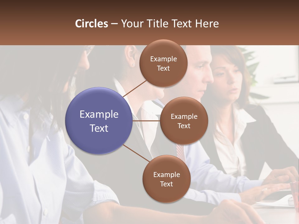 A Group Of People Sitting At A Table Working On A Computer PowerPoint Template