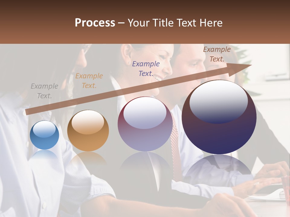 A Group Of People Sitting At A Table Working On A Computer PowerPoint Template