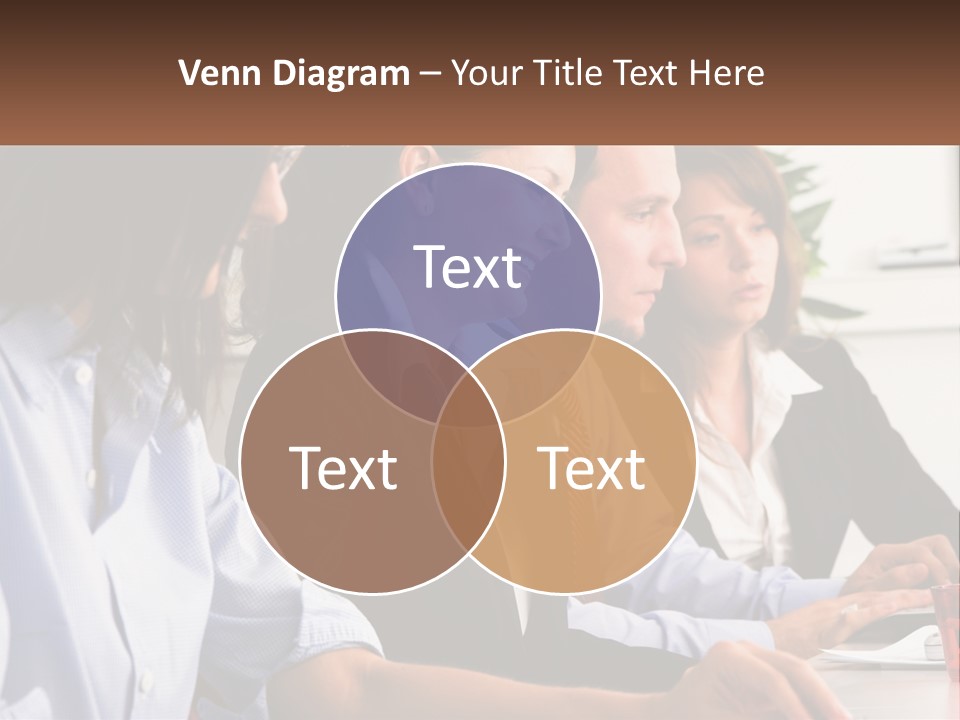 A Group Of People Sitting At A Table Working On A Computer PowerPoint Template
