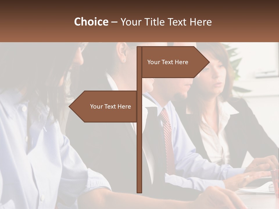 A Group Of People Sitting At A Table Working On A Computer PowerPoint Template
