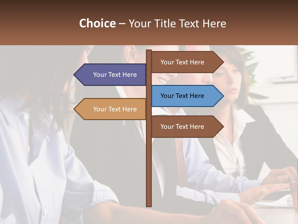 A Group Of People Sitting At A Table Working On A Computer PowerPoint Template